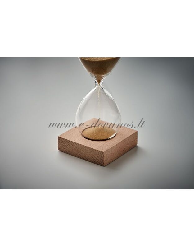 Smėlio laikrodis ant medinio pagrindo